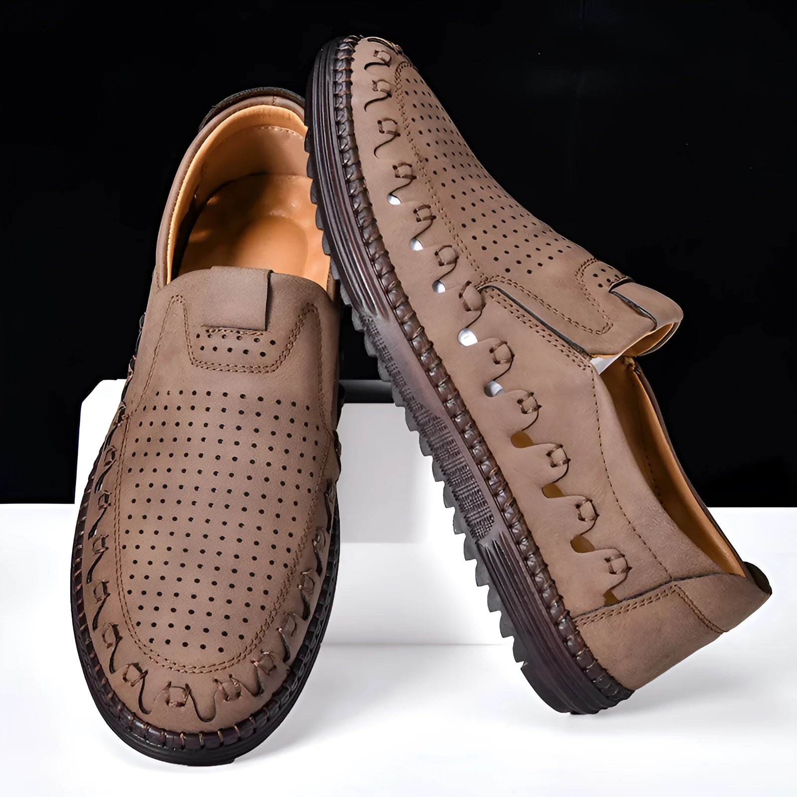 Men's brown slip-on casual shoes with round toe and flat PVC sole showing sewing line detailing