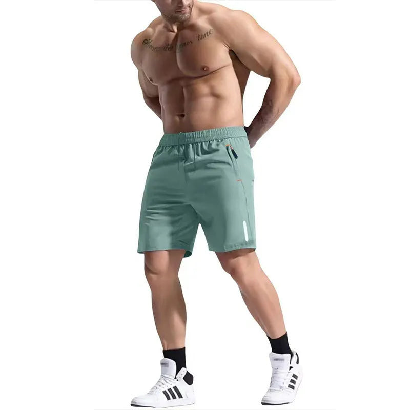 Men's grey elastic waist sports shorts made from polyester and bamboo fibre fabric on a man running outdoors.