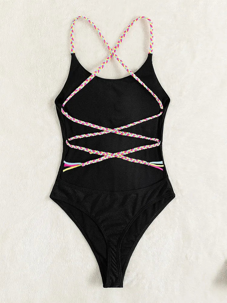 Black solid colour one-piece swimsuit for women with a backless design and sleeveless cut.