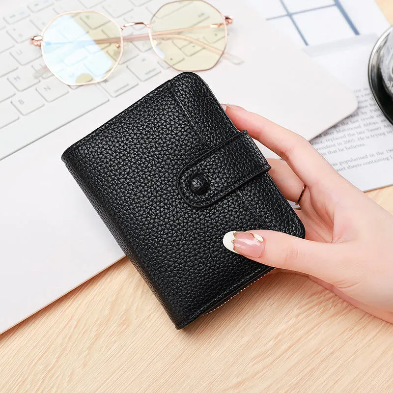 Ladies short wallet in PU leather with a lychee pattern, shown folded, in beige, pink, black, and red colour options.