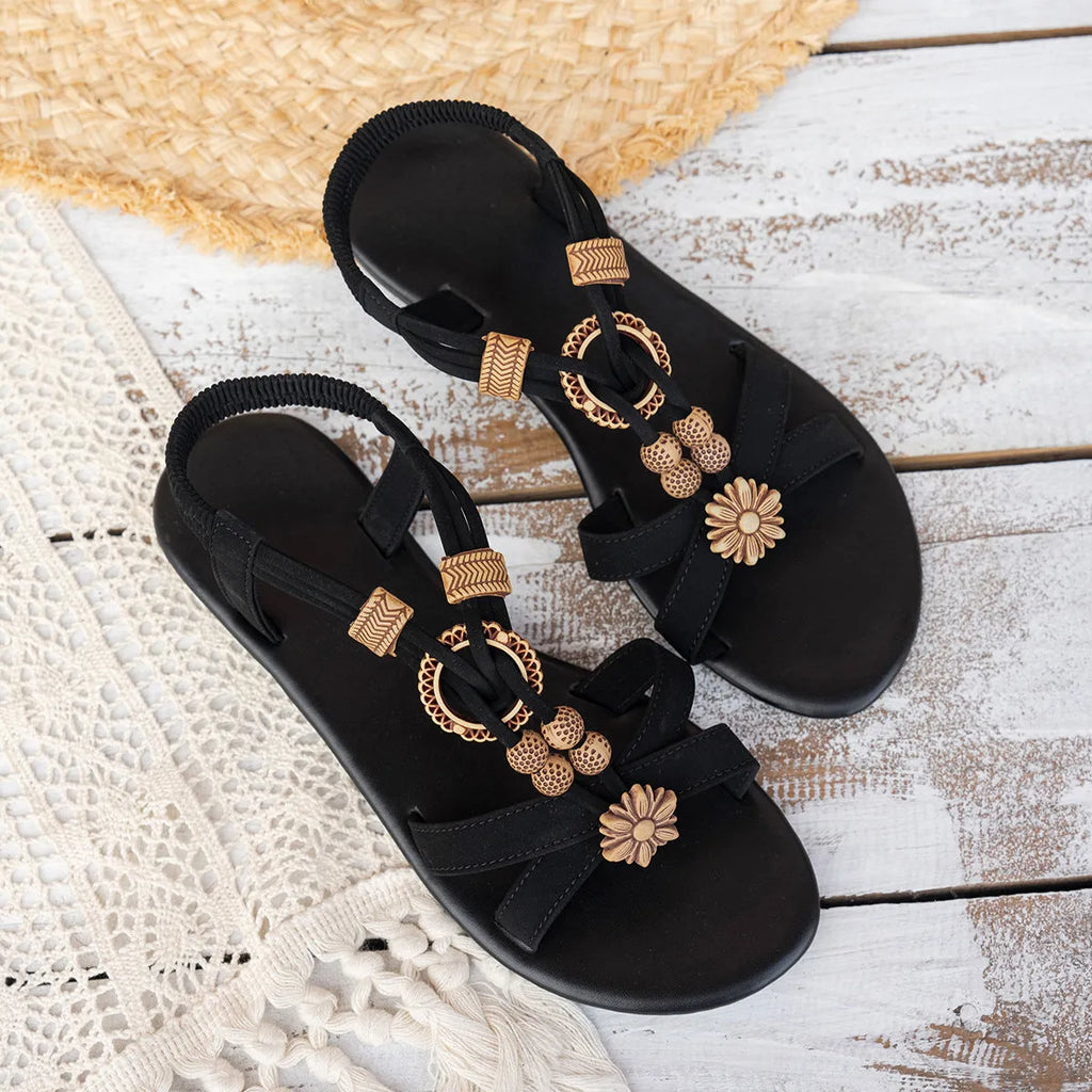Black ethnic style flat women's sandals with beaded weave, rhinestone decorations, and an elastic band.