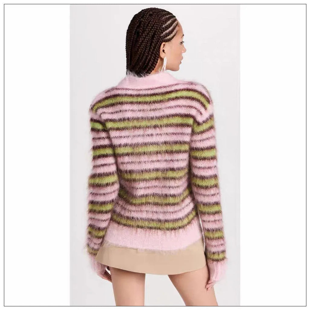 Pink wool lazy coat Haima cardigan sweater with nap craft texture on a hanger.