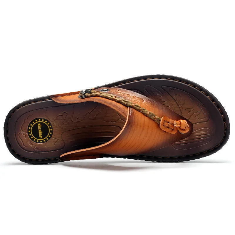 Men's dark blue herringbone pattern outdoor slippers with a leather lining and rubber sole.