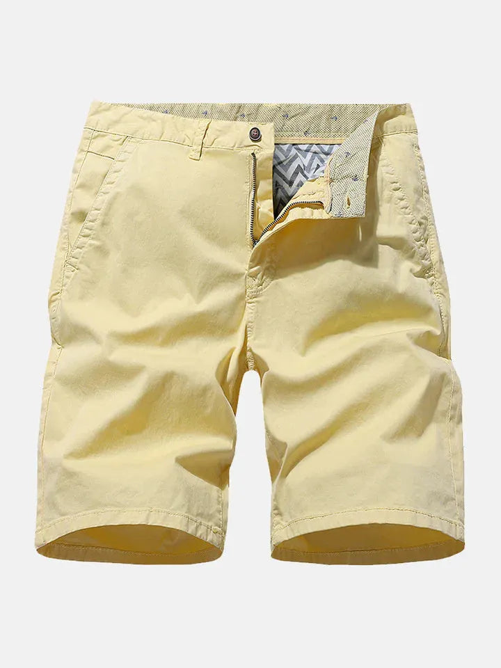 Men's loose fit denim shorts with elastic waist in a printed blue design, laid flat.