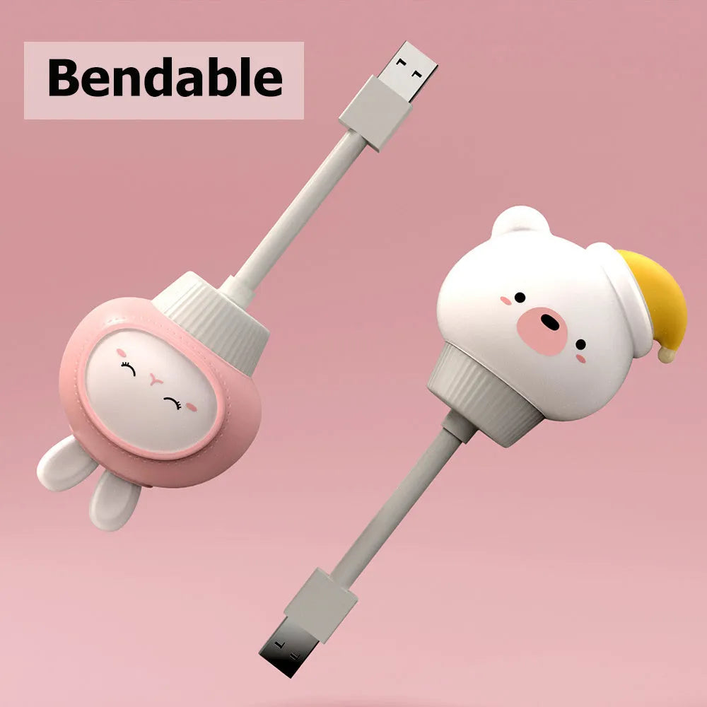Cartoon bear-shaped USB night light with remote control on bedside table