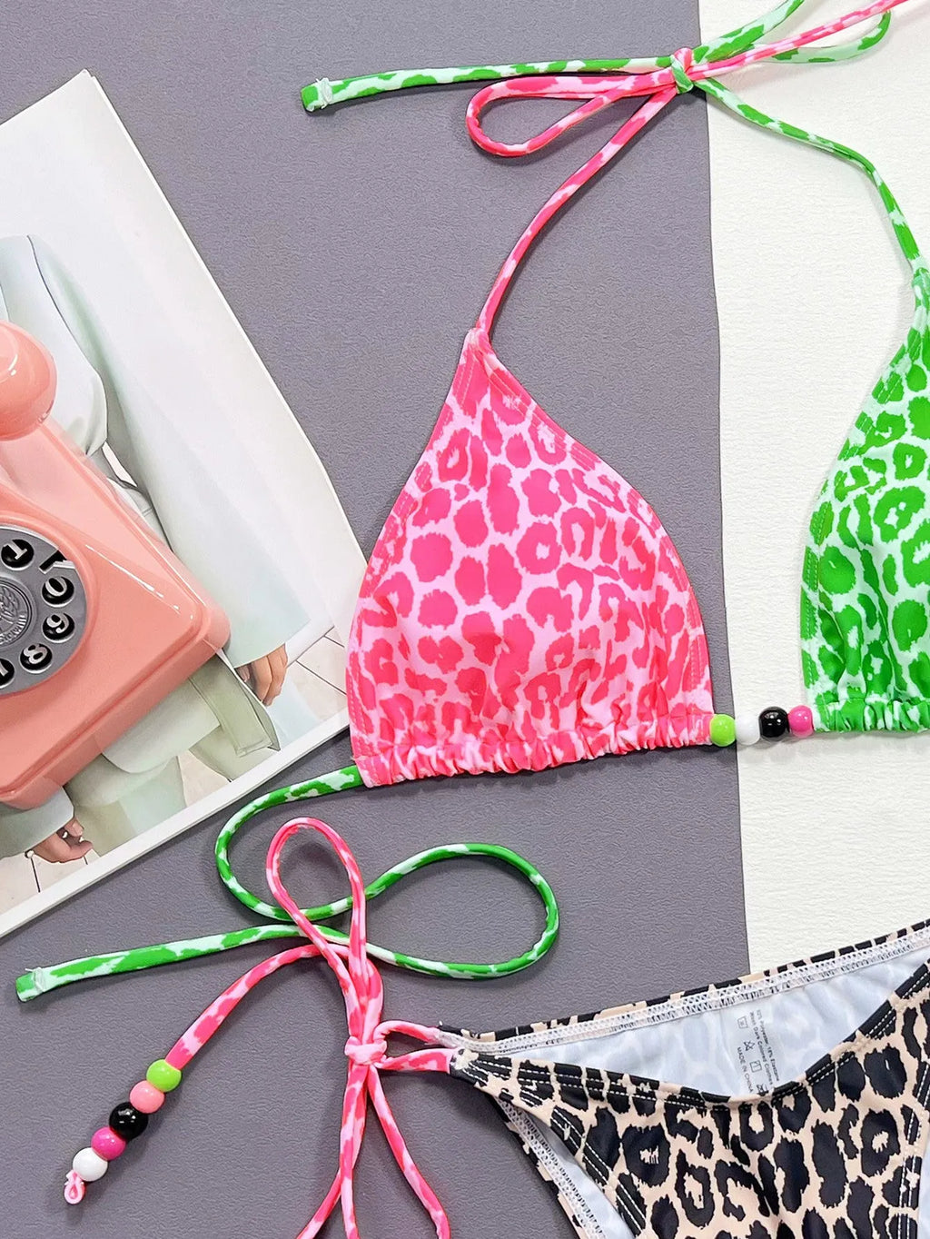 Women's leopard print bikini swimsuit with split briefs style showing bra and panties components