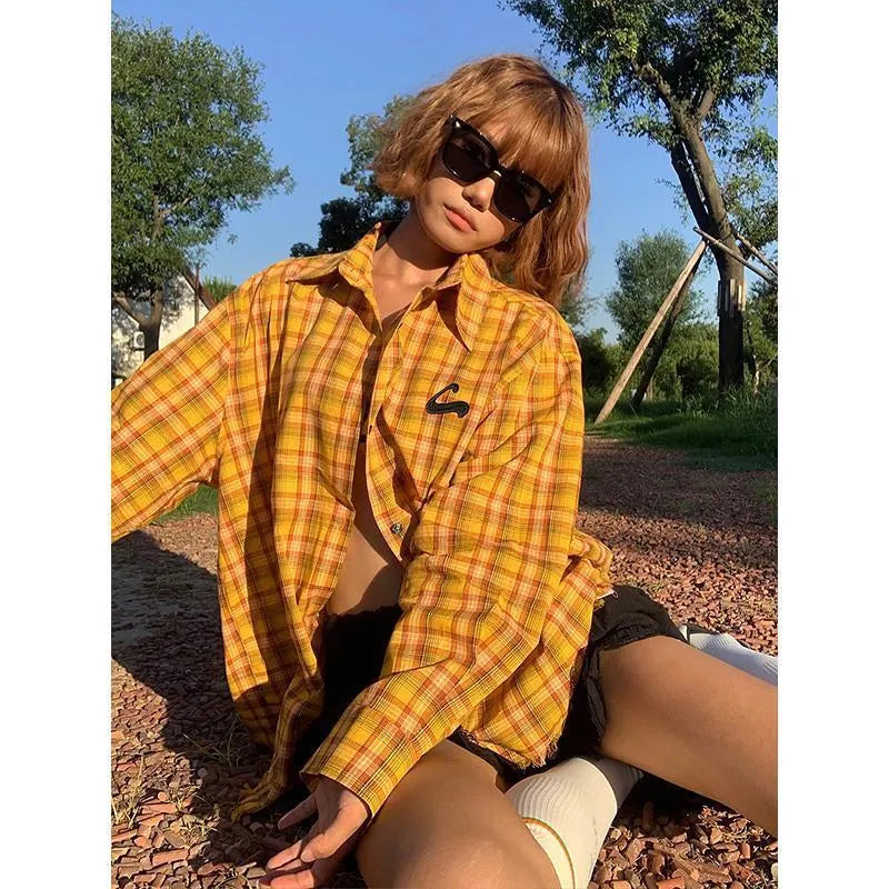 Loose-fitting dopamine yellow plaid cardigan-style shirt on a hanger