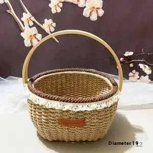 A hand-woven straw basket in a coffee brown colour, measuring 19cm by 12cm.