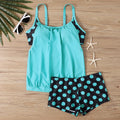 Women's black polka dot high-waist boxer swimsuit briefs made from polyester fabric.
