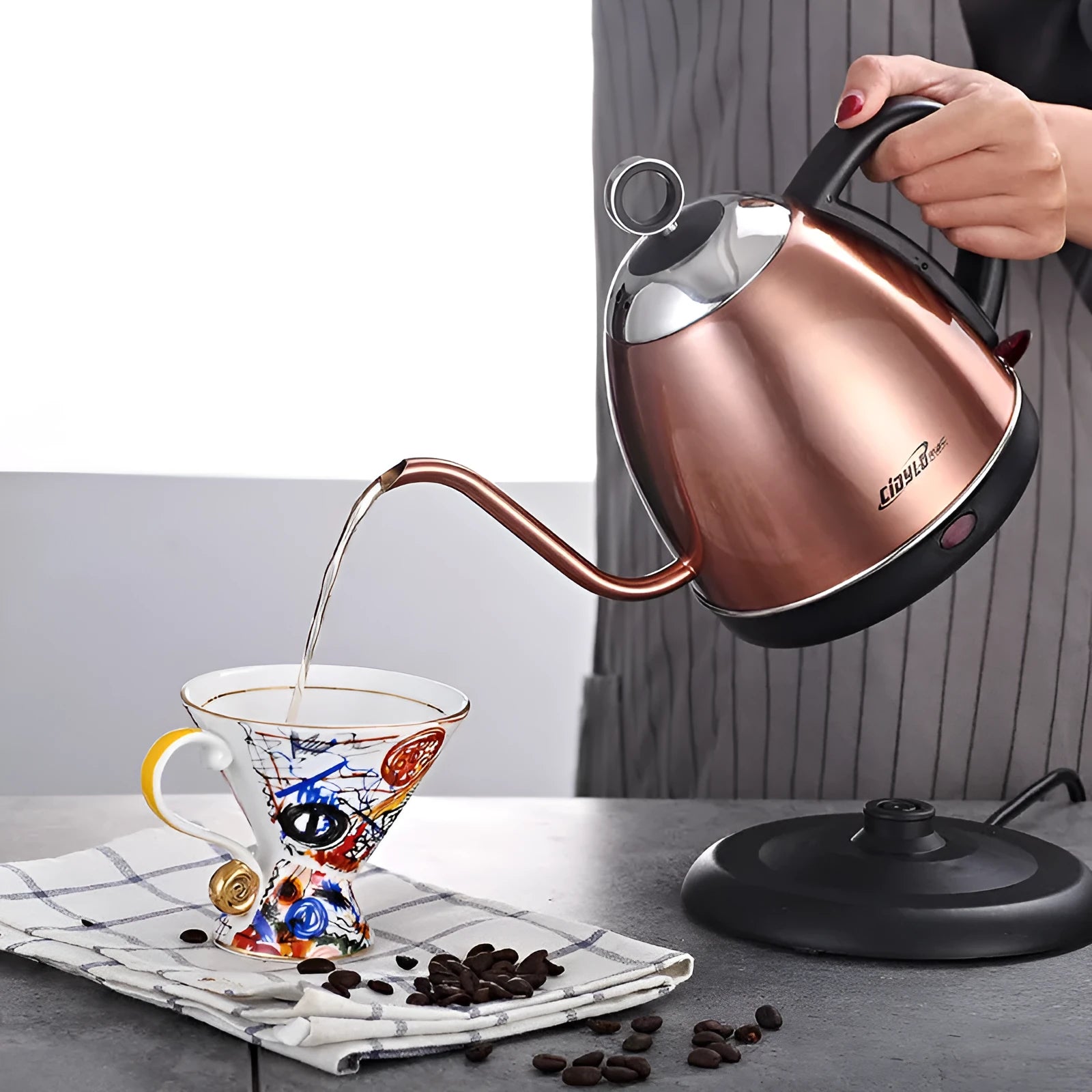 Stainless steel electric kettle in gold colour with touch controls and 1 litre capacity