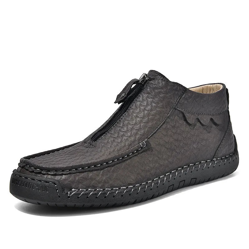 Men's black slip-on loafers with a round toe and rubber sole on a white background.