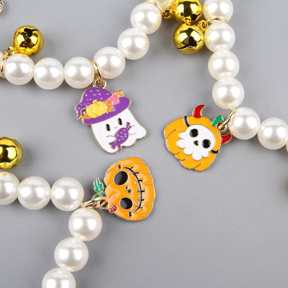 Halloween pet collar charm with simulated pearls and a choice of pumpkin or ghost decoration.