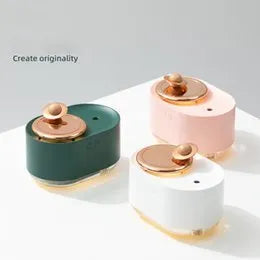 Rotating planet USB humidifier with night light in green colour showing mist output