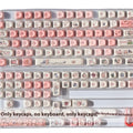 Pink PBT key cap set with a colourful fragrant pig character design on a keyboard.