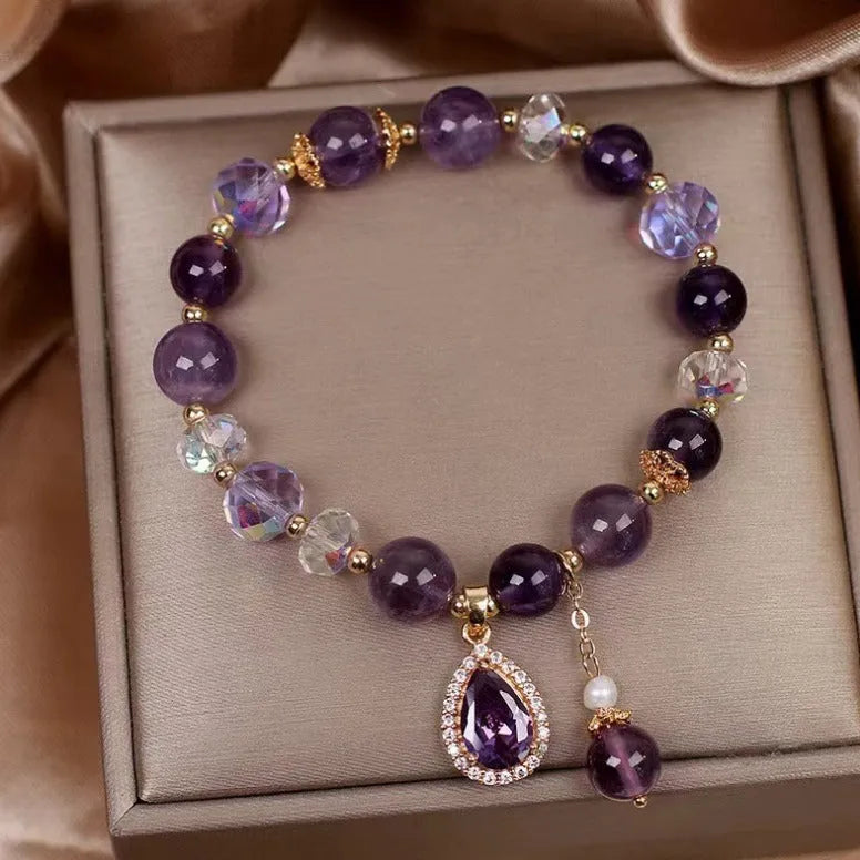 Close-up of a women's bracelet with natural purple amethyst stones set using micro inlay craftsmanship.