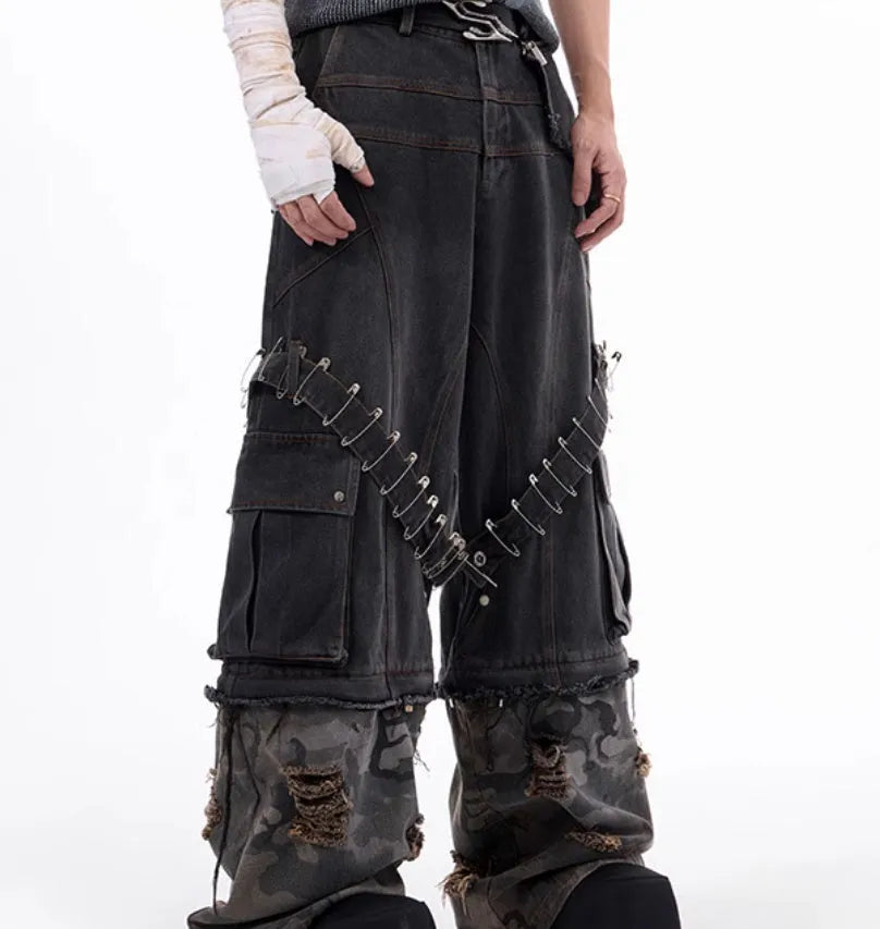 Grey camouflage men's jeans with panel splicing construction and ribbon detailing.