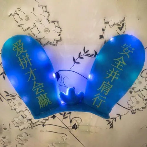Rabbit Glow Ears helmet decoration with locomotive and ski designs on a Velcro base