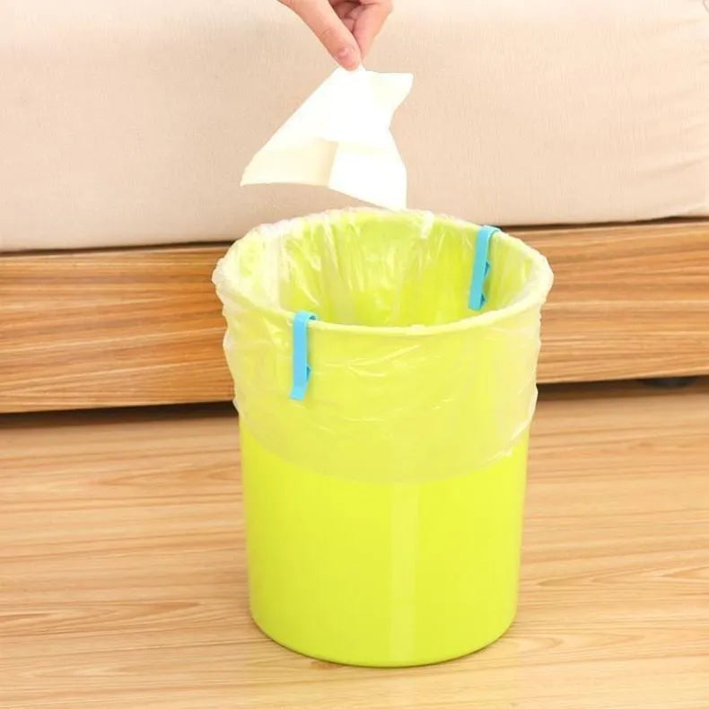 Grey PP plastic non-slip clip for fixing a bin bag to a waste bin rim.