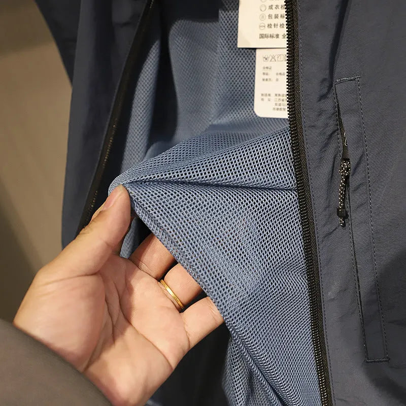 Men's straight-cut nylon vest cardigan in army green with side seam pockets, shown open as a lightweight layer.