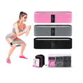 Three fabric resistance bands in lake blue, pink, and purple colours with mesh storage bag