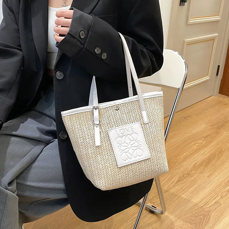 Women's straw woven shoulder bag in European retro style with three-dimensional pocket and sewing thread detail