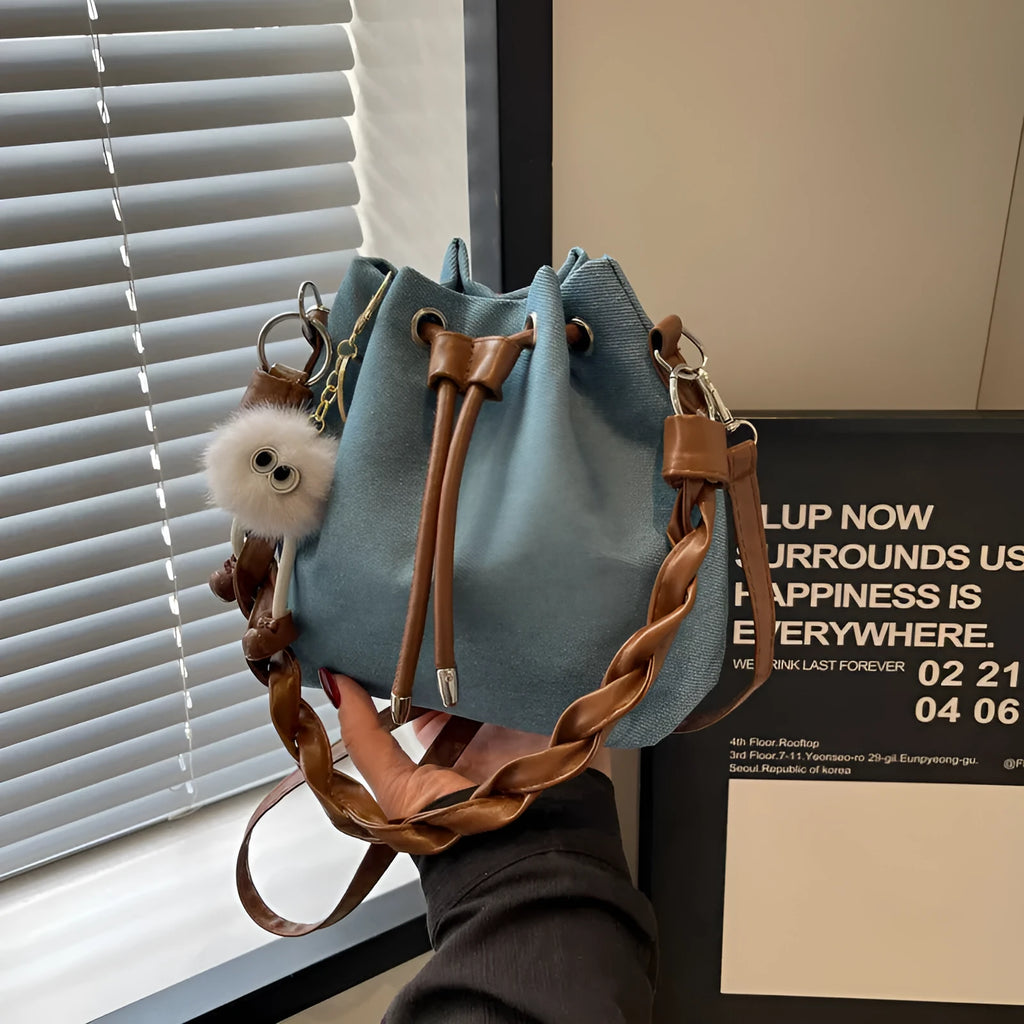 Blue one-shoulder cross body bucket messenger bag with synthetic leather lining