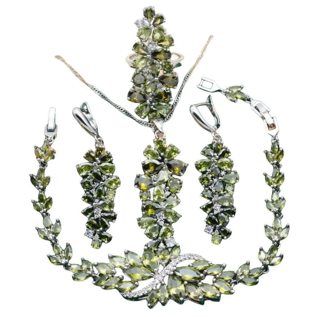 Retro style jewellery set showing necklace with floral pendant, bracelet, earrings, and ring in olive and purple colours.