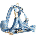 Blue cloth dog collar, leash, vest, and decorative bow four-piece pet accessory set.