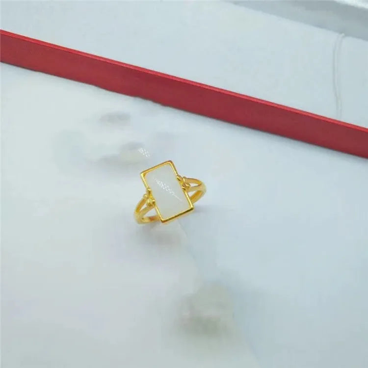 Adjustable brass gold-plated ring with electroplated gemstone in black, green or white options