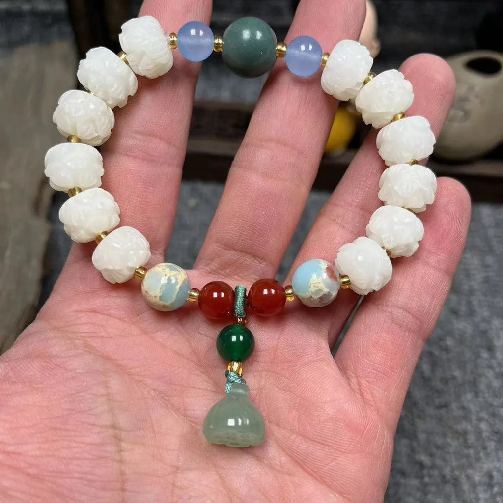 Carved bodhi root pumpkin lotus bracelet with white jade beads and mixed sizing