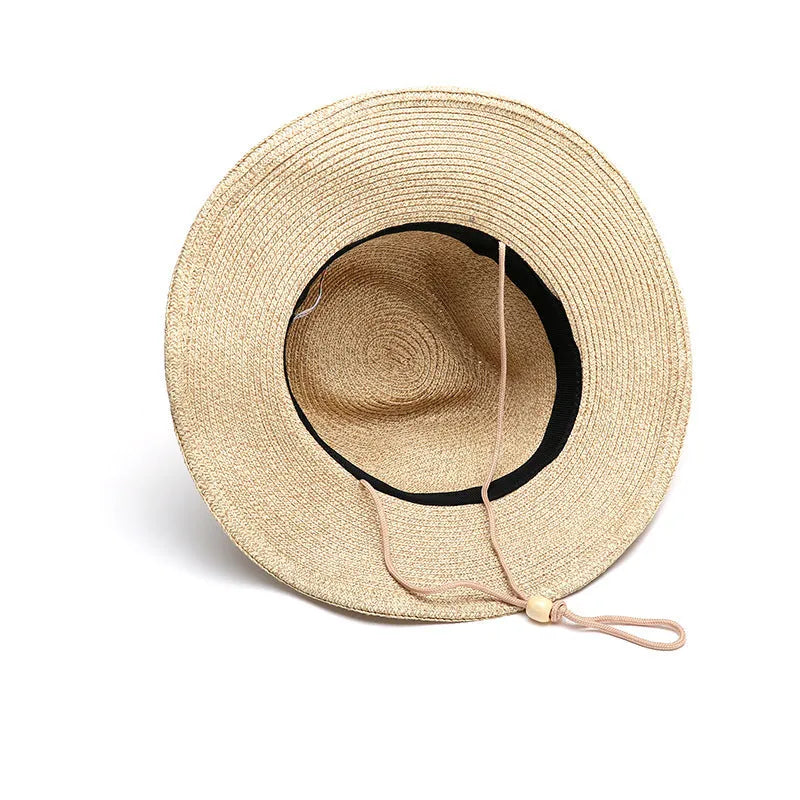 Men's foldable straw sun hat with wide brim shown in natural beige colour