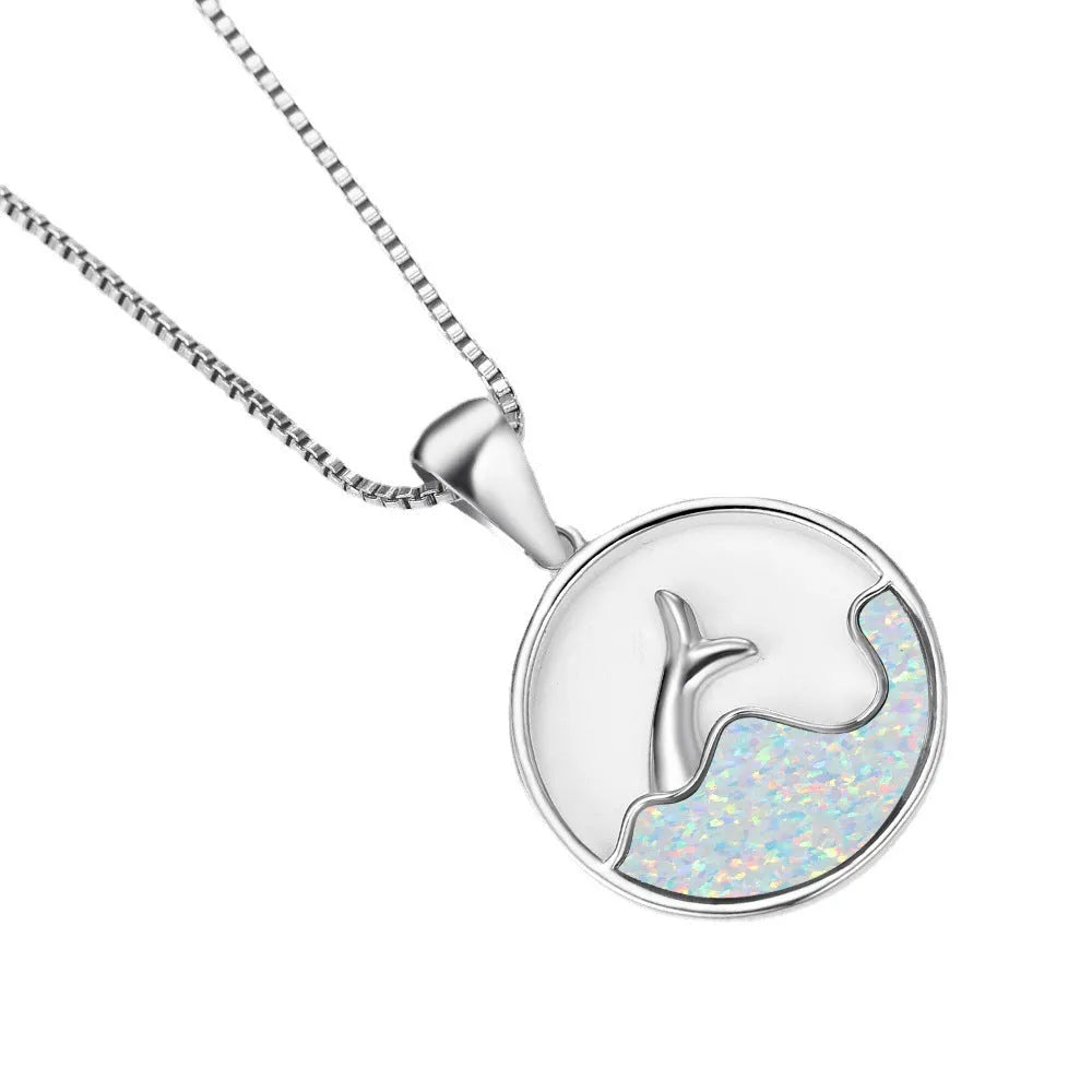 A geometric round opal pendant necklace with a fishtail design on a chain.