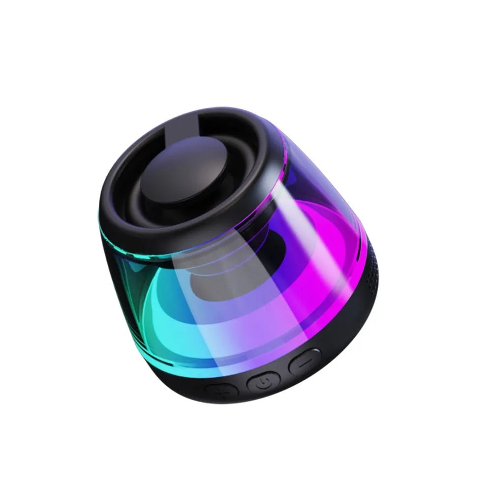 Compact white Bluetooth speaker with LED light on a magnetic base.