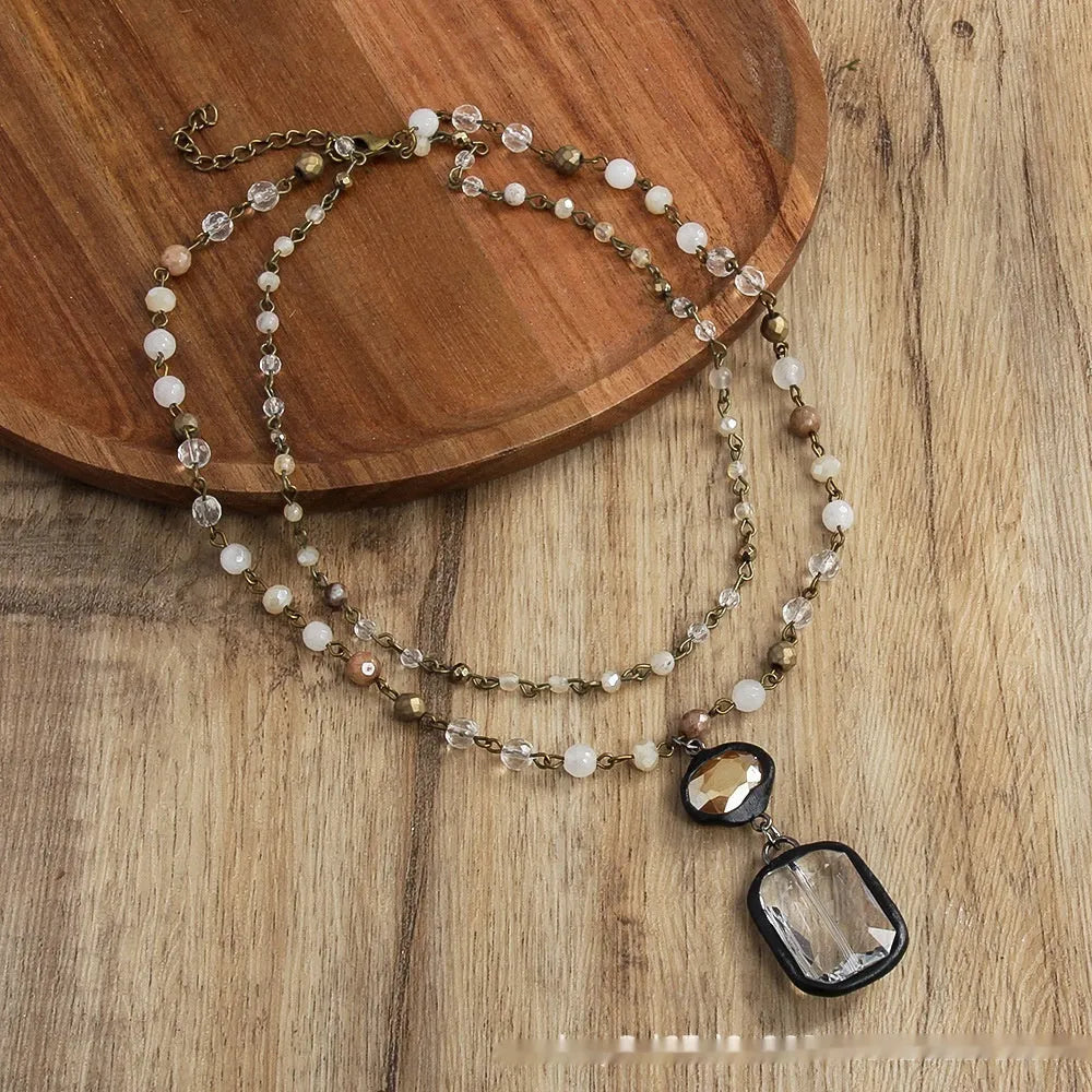 Tribal two-layer necklace with glass pendant and stone elements on adjustable chain