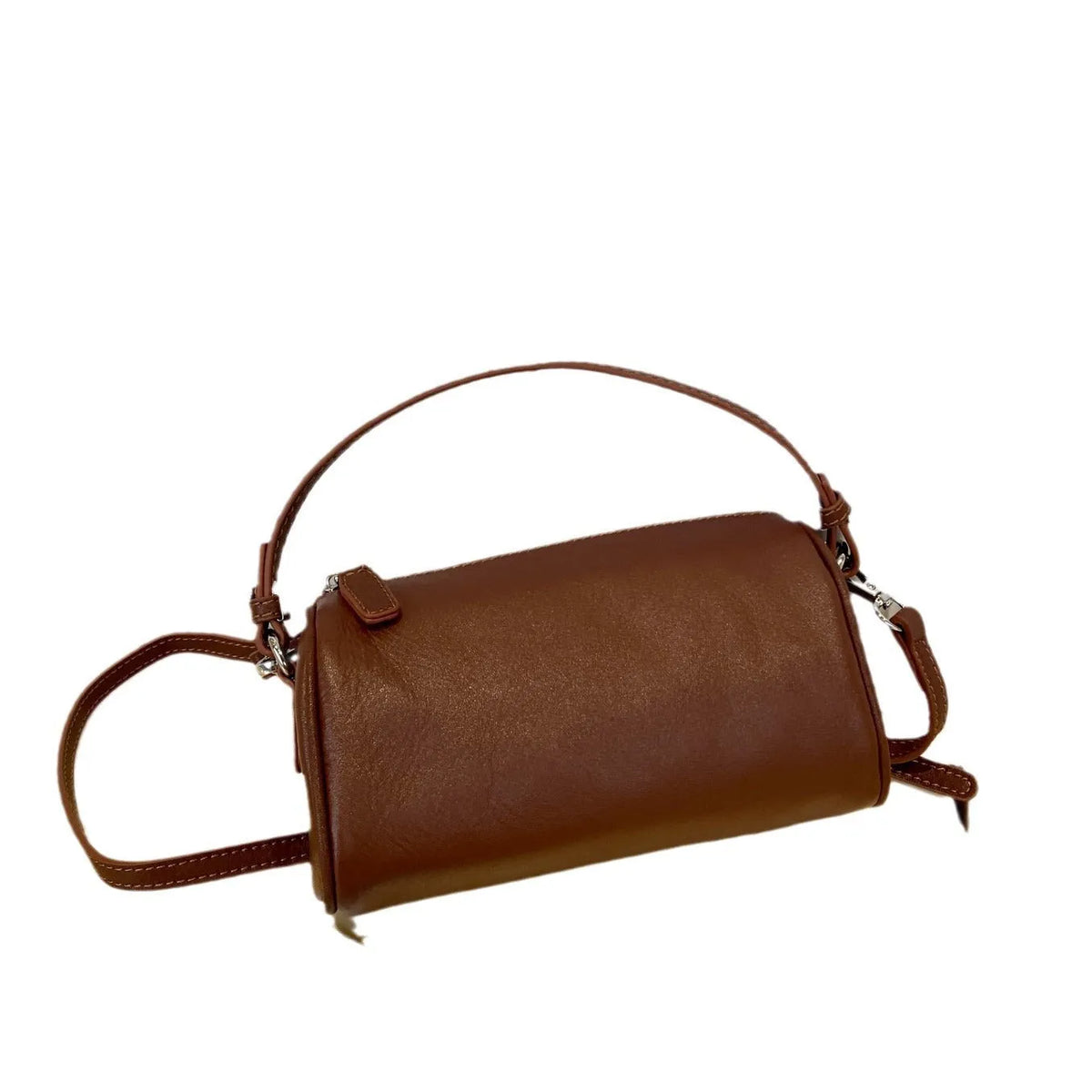 Soft genuine leather cylindrical crossbody bag for mobile phones in brown colour with visible stitching.