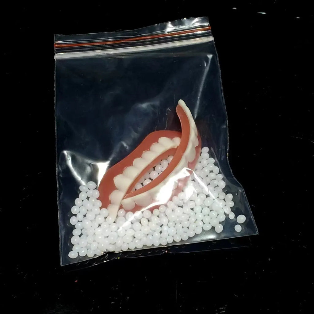 Silicone simulation smile dentures with upper and lower teeth in colour box packaging for dental training