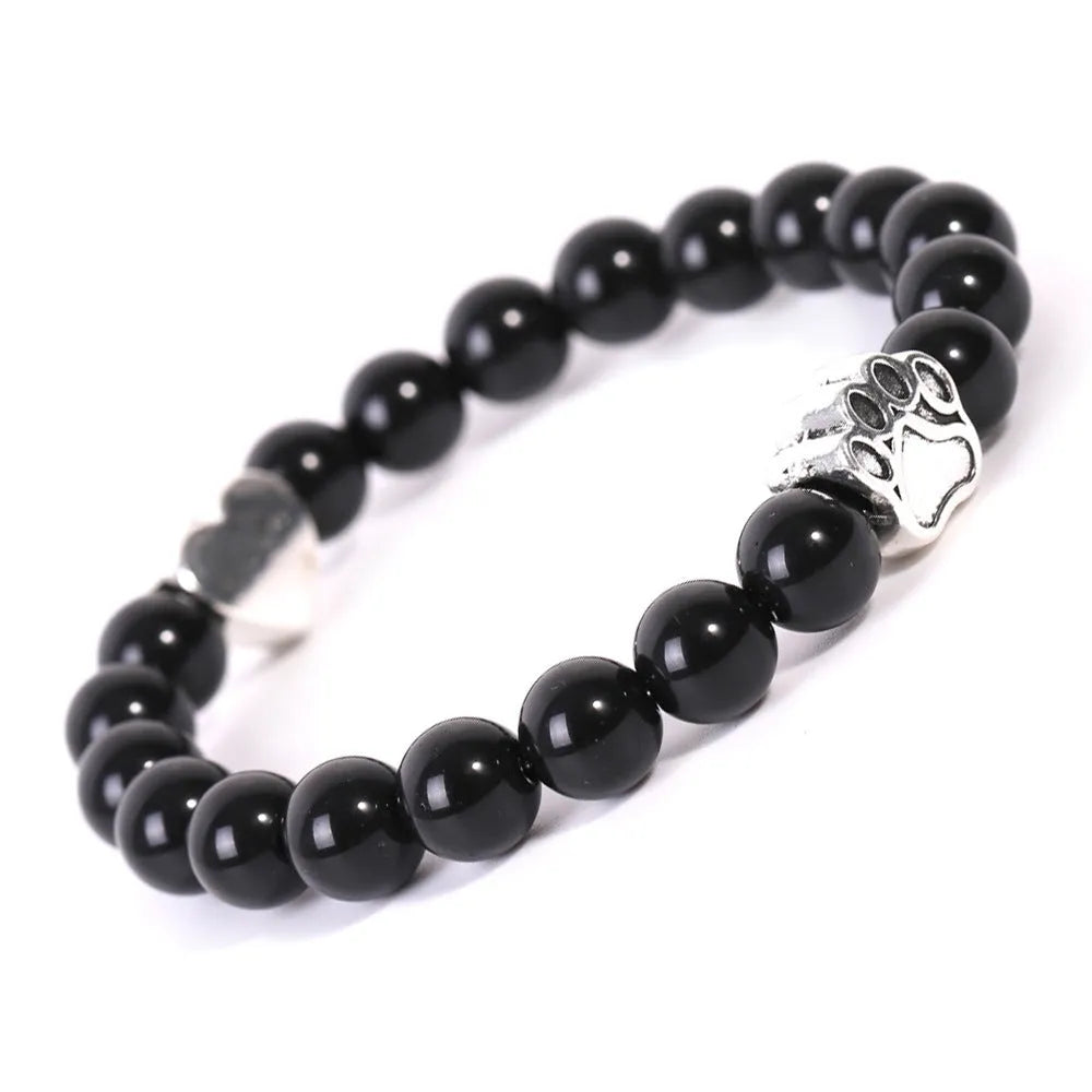 Tiger's Eye and Indian Agate stone beaded bracelet with a dog's paw charm on a white background.
