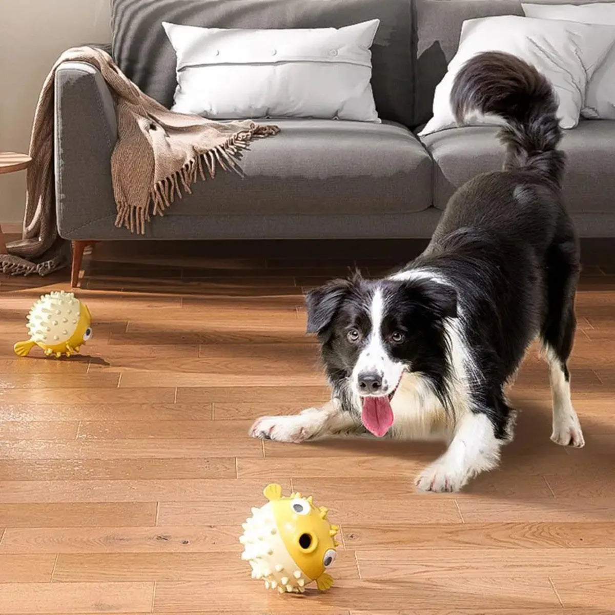 Yellow vinyl fish-shaped dog chew toy with textured surface for aggressive chewers.