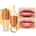 Honey-coloured lip gloss with keychain attachment for portable carrying on bags