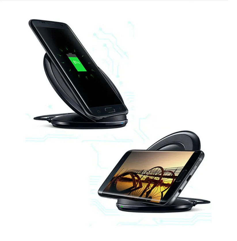 A black or white wireless charging pad for a Samsung Galaxy Note Edge mobile phone on a desk.