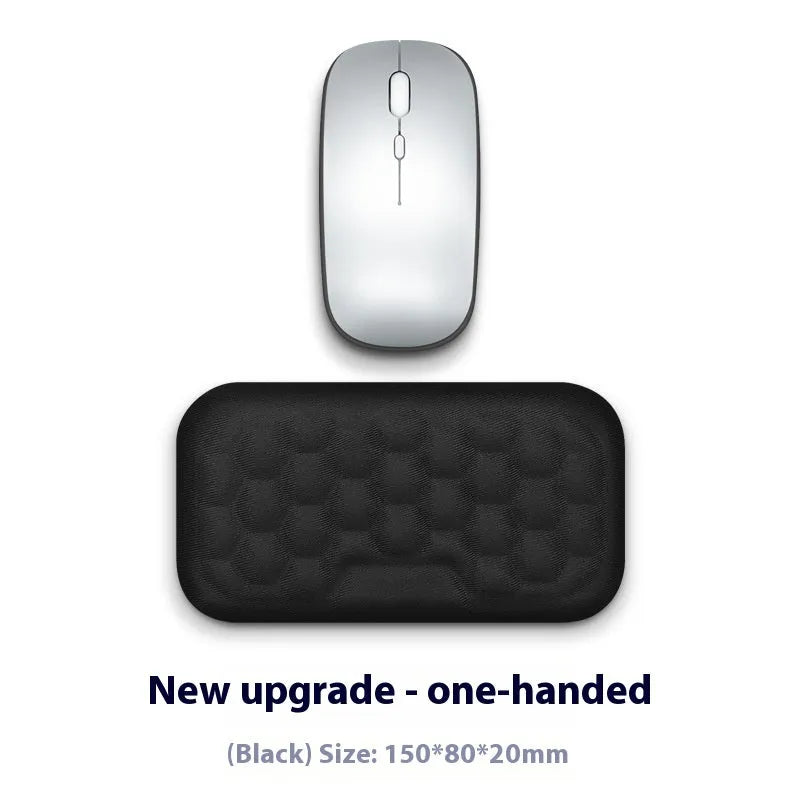 Memory foam mouse wrist pad with silicone bottom in black cloth cover on computer desk