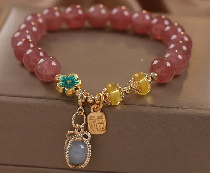 Red women's bracelet with strawberry quartz beads, alloy settings, and sparkling rhinestone details.