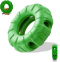 Blue rubber tyre-shaped dog chew toy with six oval openings for treat dispensing