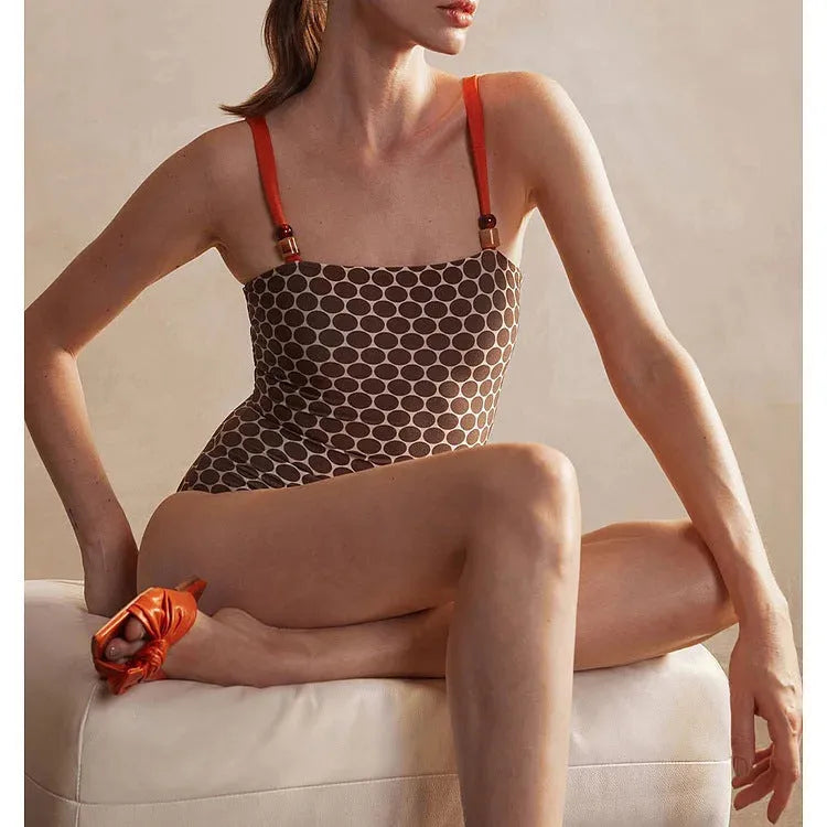 Dot printed one-piece swimsuit with matching wrap skirt in polyester fabric