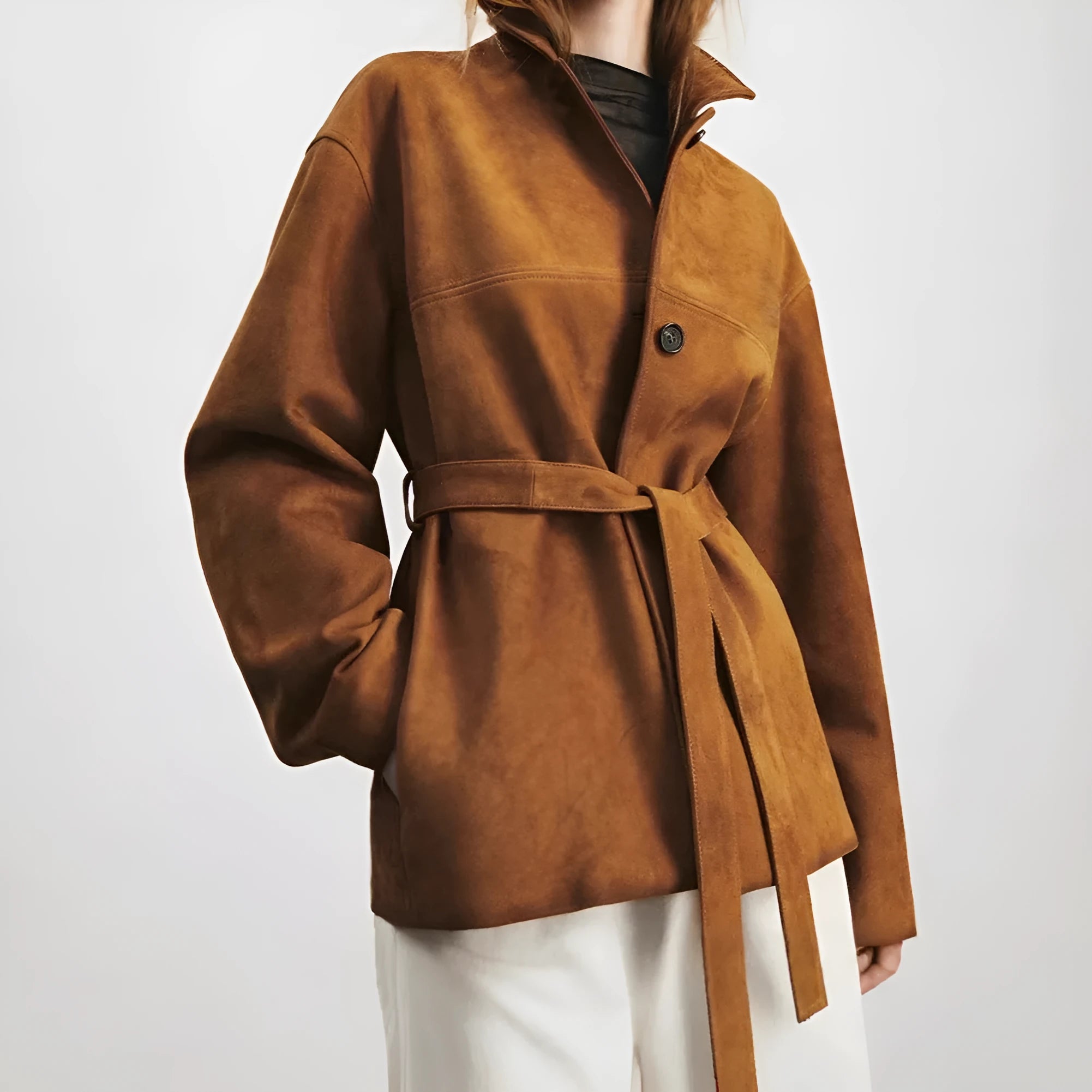 Women's retro style cashmere coat with Peter Pan collar and leather stitching details in loose fit mid-length design