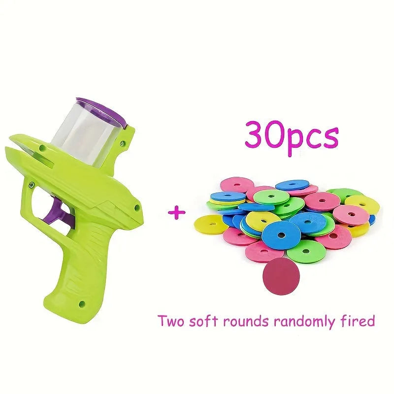 Green interactive cat toy launcher with three foam discs for battery-free feline play