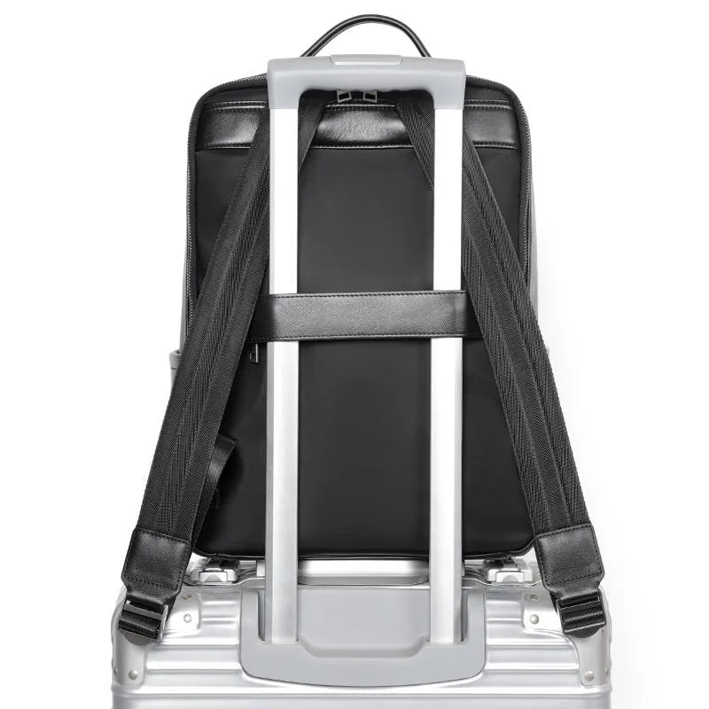 Men's large black leather computer backpack with 36-55L capacity for business and travel