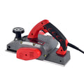 Red desktop electric planer with aluminium housing for woodworking showing 82mm planing width