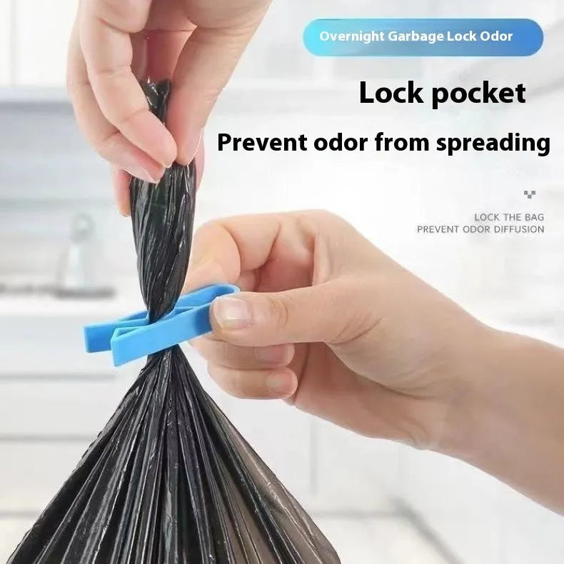 Grey PP plastic non-slip clip for fixing a bin bag to a waste bin rim.