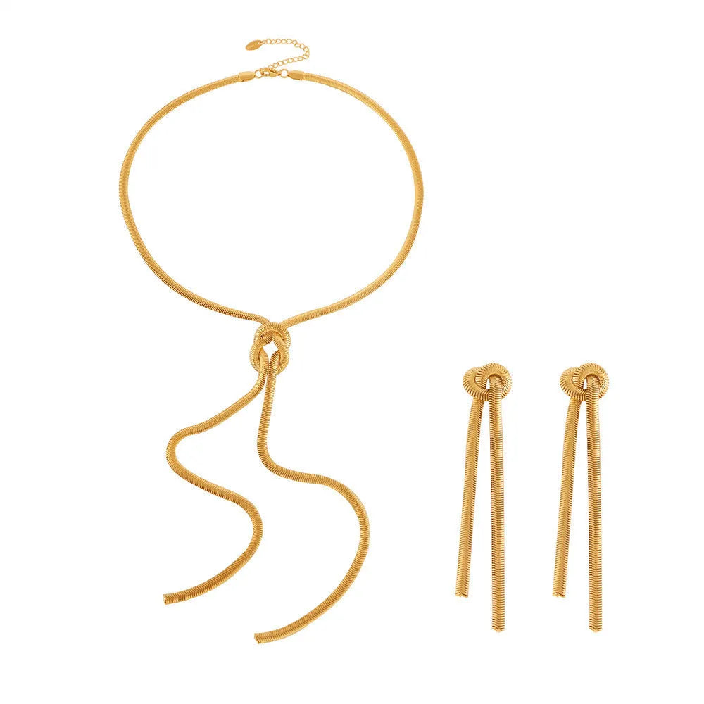 Gold electroplated titanium steel necklace with knotted tassel pendant and matching earrings